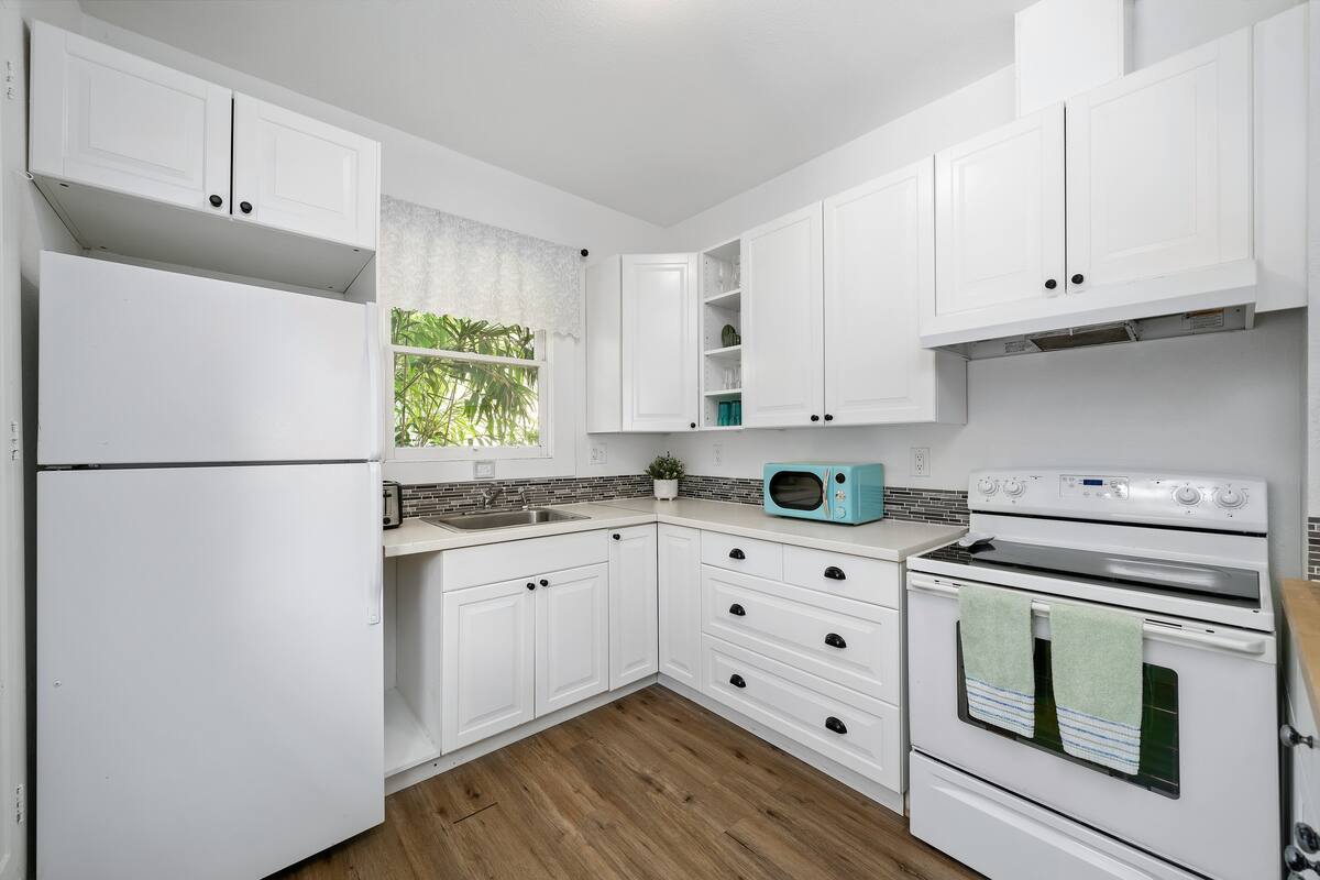 Modern kitchen with all the essentials and plenty of counter space, ideal for preparing delicious meals.