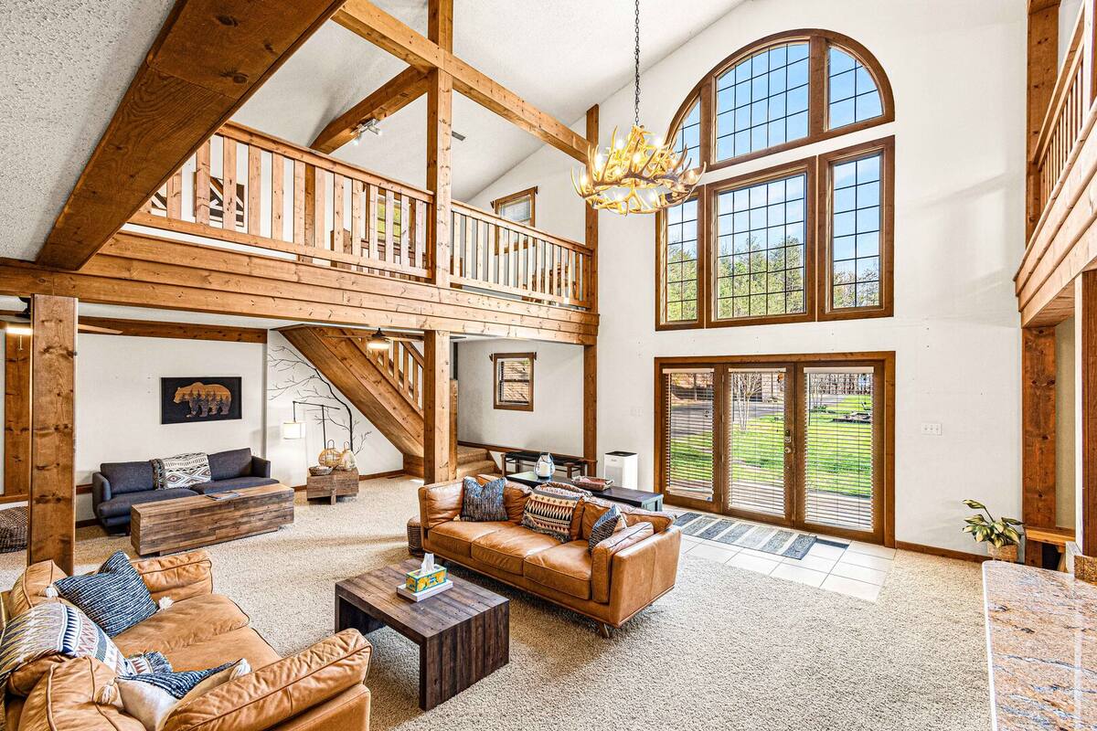 Sink into blissful relaxation in this stunning living room adorned with plush, cozy seating.