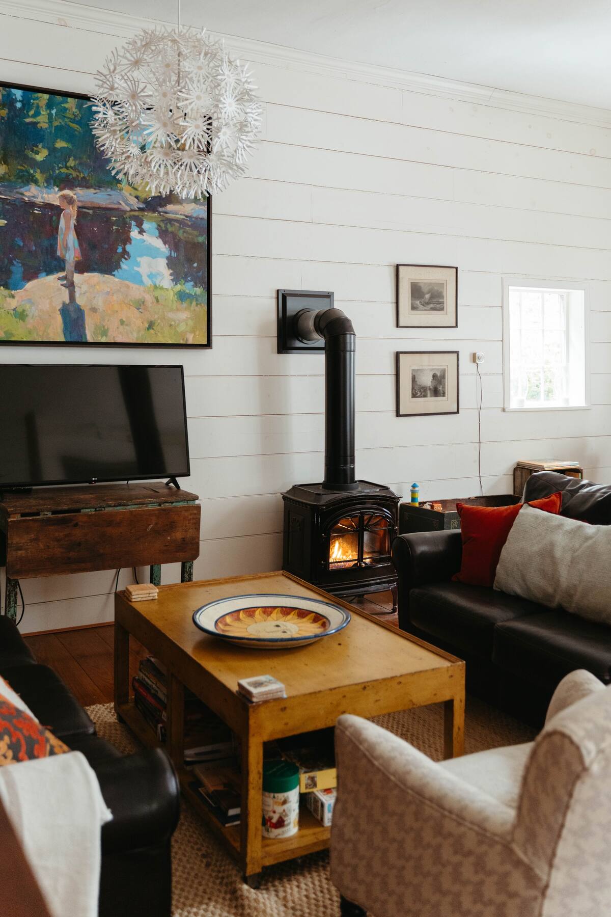 Cozy stove and TV corner in the great room! Perfect for curling up on a chilly day! 