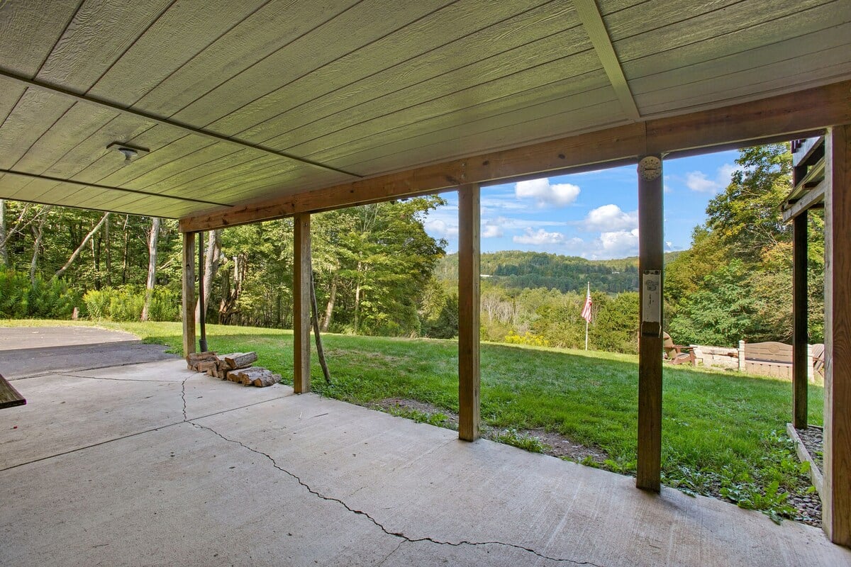 Porch area right outside the basement door. To the right is the Hot tub.
