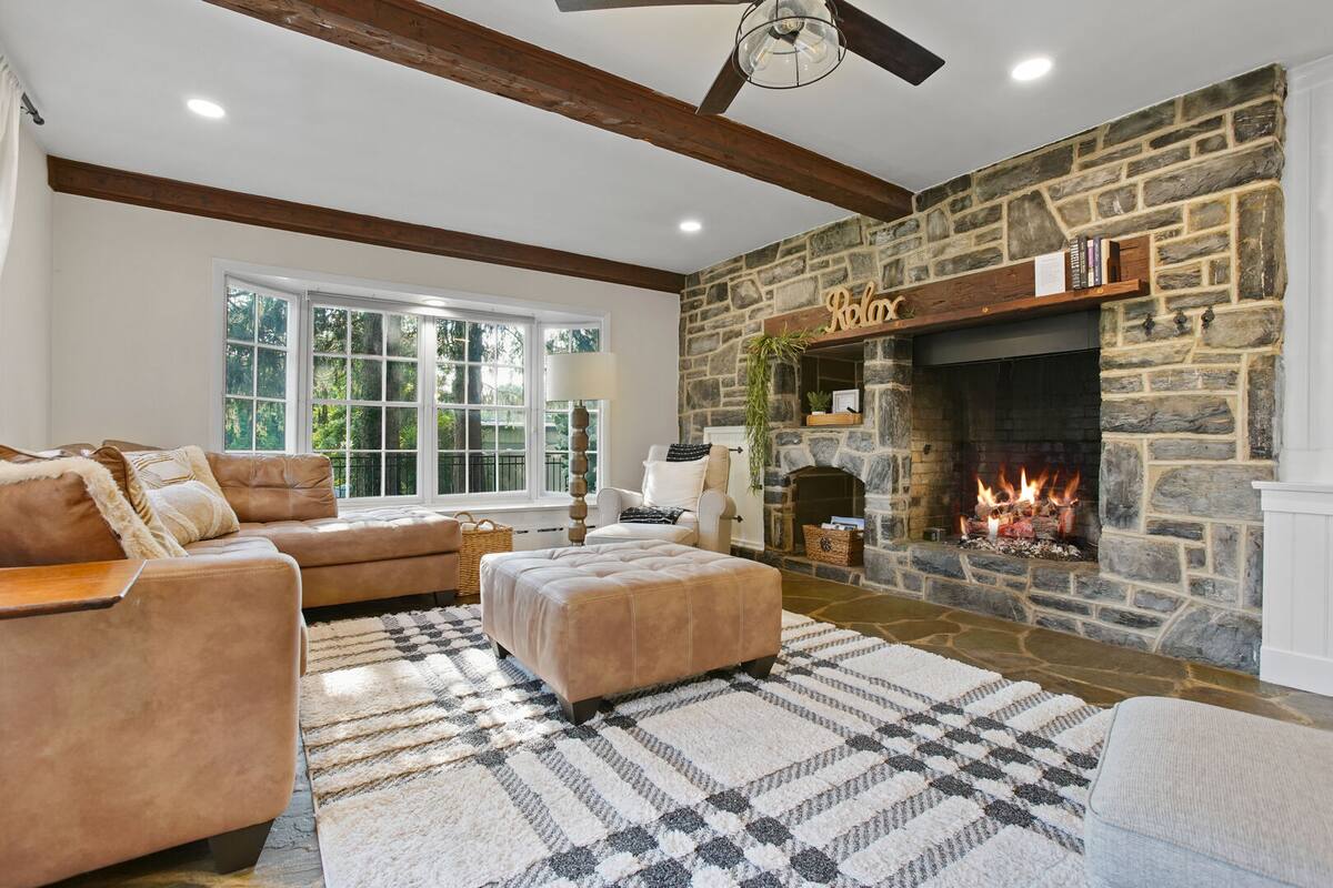 Cozy lounging space with big stone fire place right next to the kitchen!