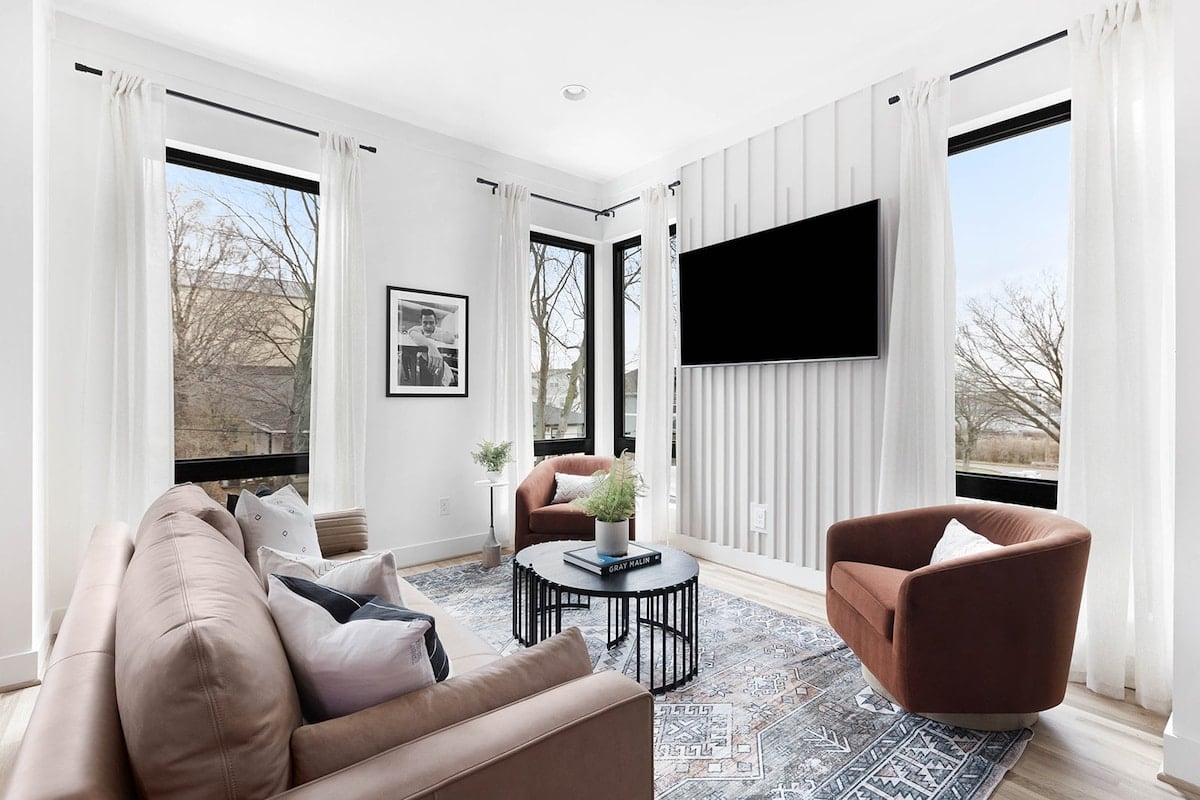 Spacious Living Room with Elegant Décor and Natural Light
