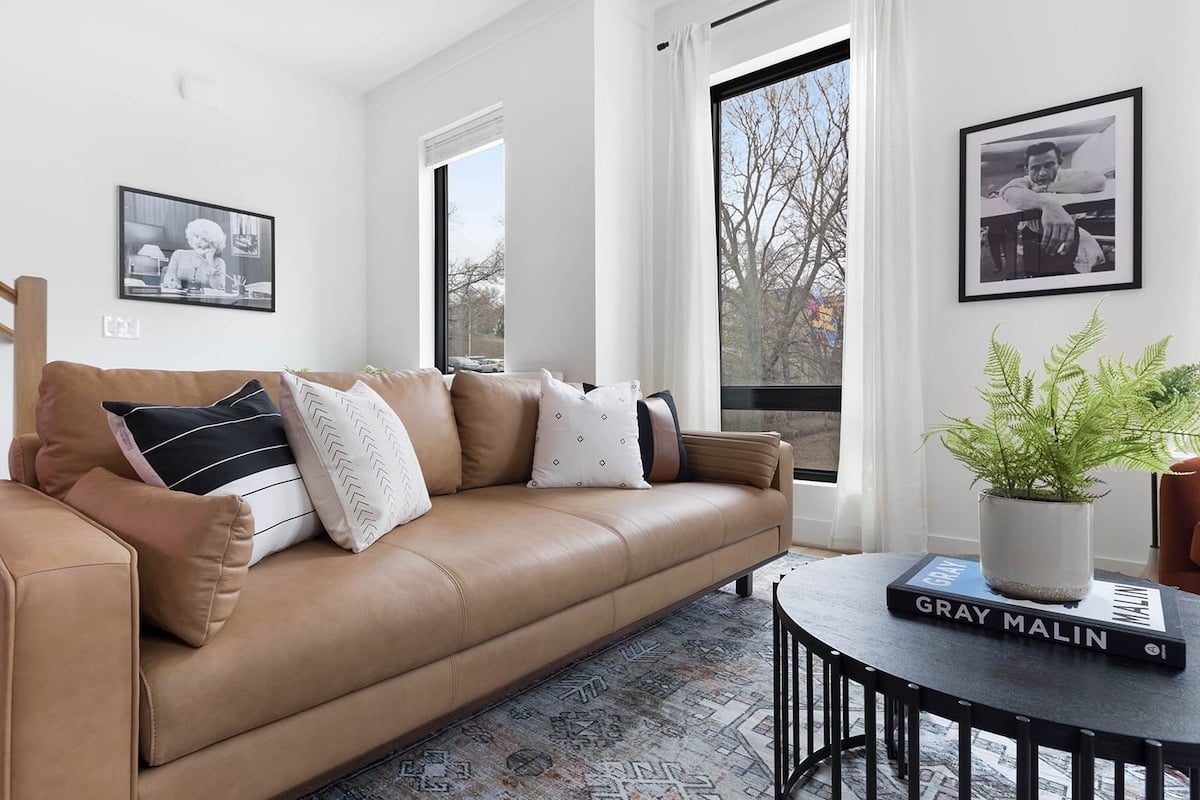 Spacious Living Room with Elegant Décor and Natural Light
