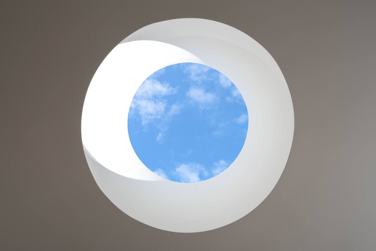 A grand skylight floods the open space with elegance and natural light.