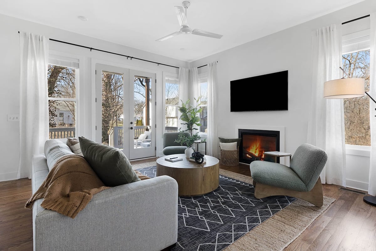 Warm Living Room with Fireplace and Comfortable Sofas