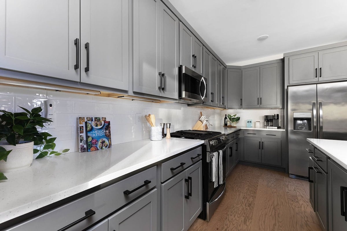 The expansive gourmet kitchen boasts an oversized island, plenty of counter space, and high-end stainless steel appliances.