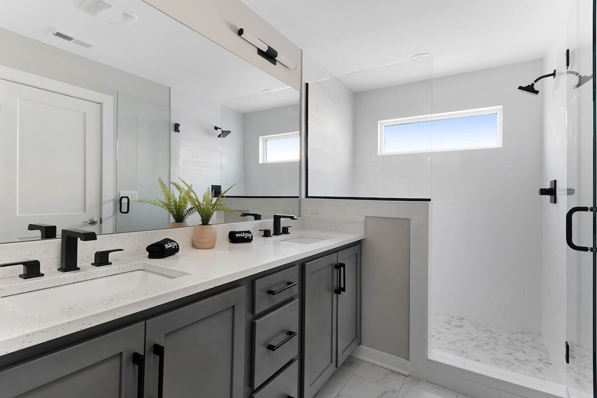 The double vanity in the master bathroom offers ample storage and generous counter space.