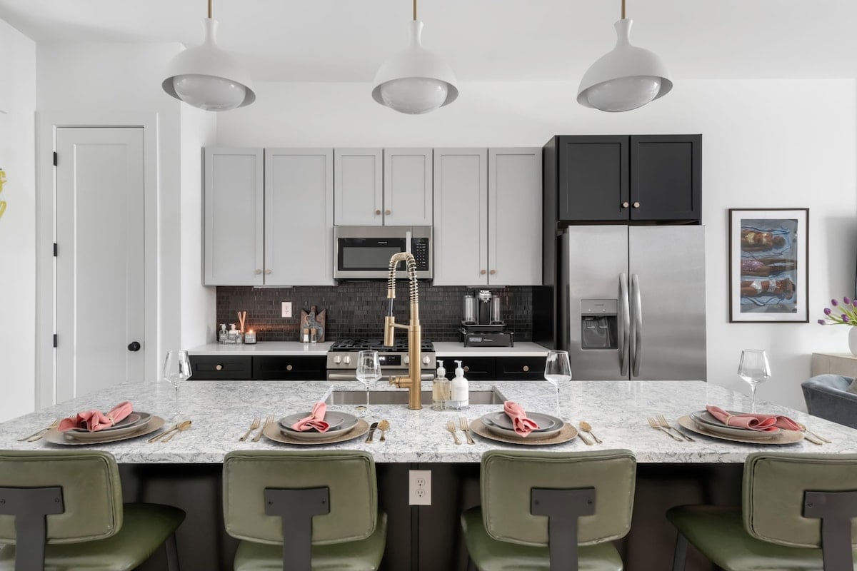Clean and Spacious Kitchen with Sleek Countertops and Seating