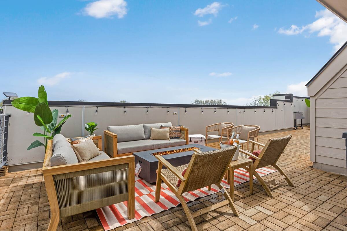Cozy Rooftop Fire Pit Area Perfect for Gatherings and Relaxation