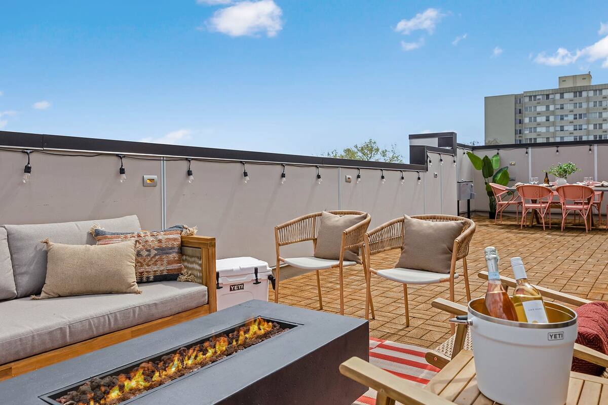 Cozy Rooftop Fire Pit Area Perfect for Gatherings and Relaxation

