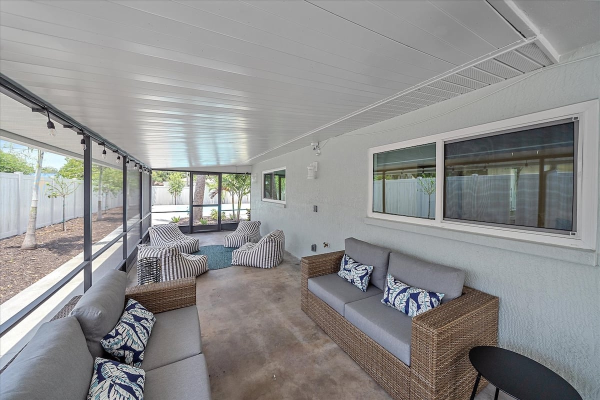 This screened porch is a guest favorite! Enjoy this comfy lounge set or the adjacent bean bag chairs!