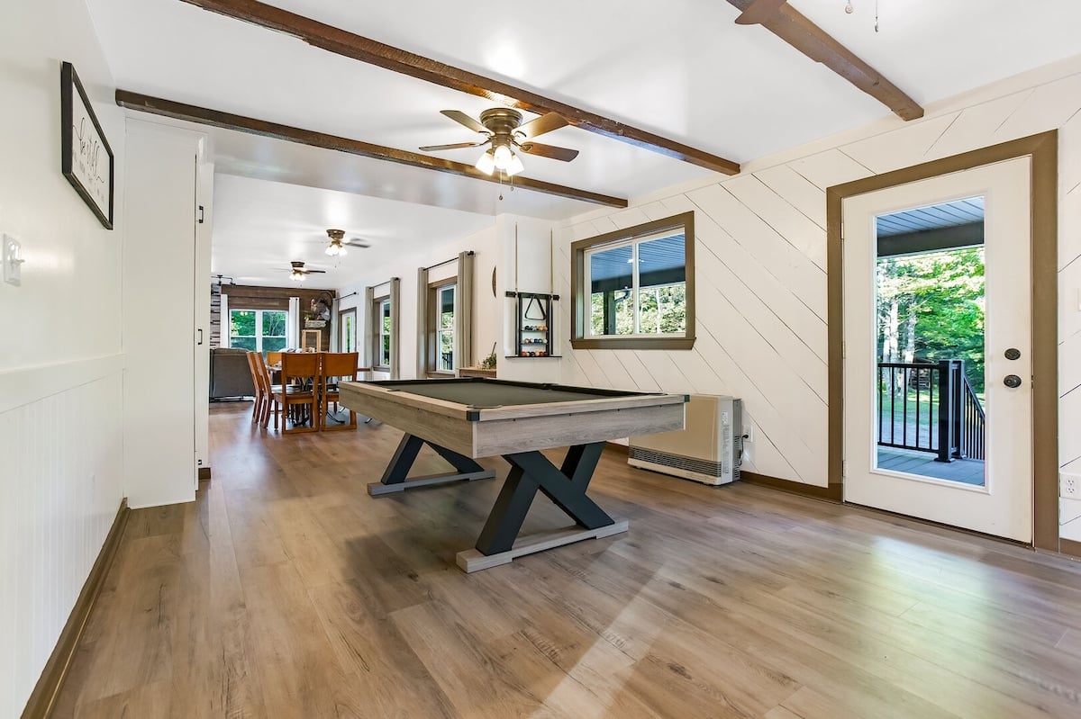 When you first enter the home, you are greeted with a full-sized pool table! This is sure to provide hours of entertainment for your group :)
