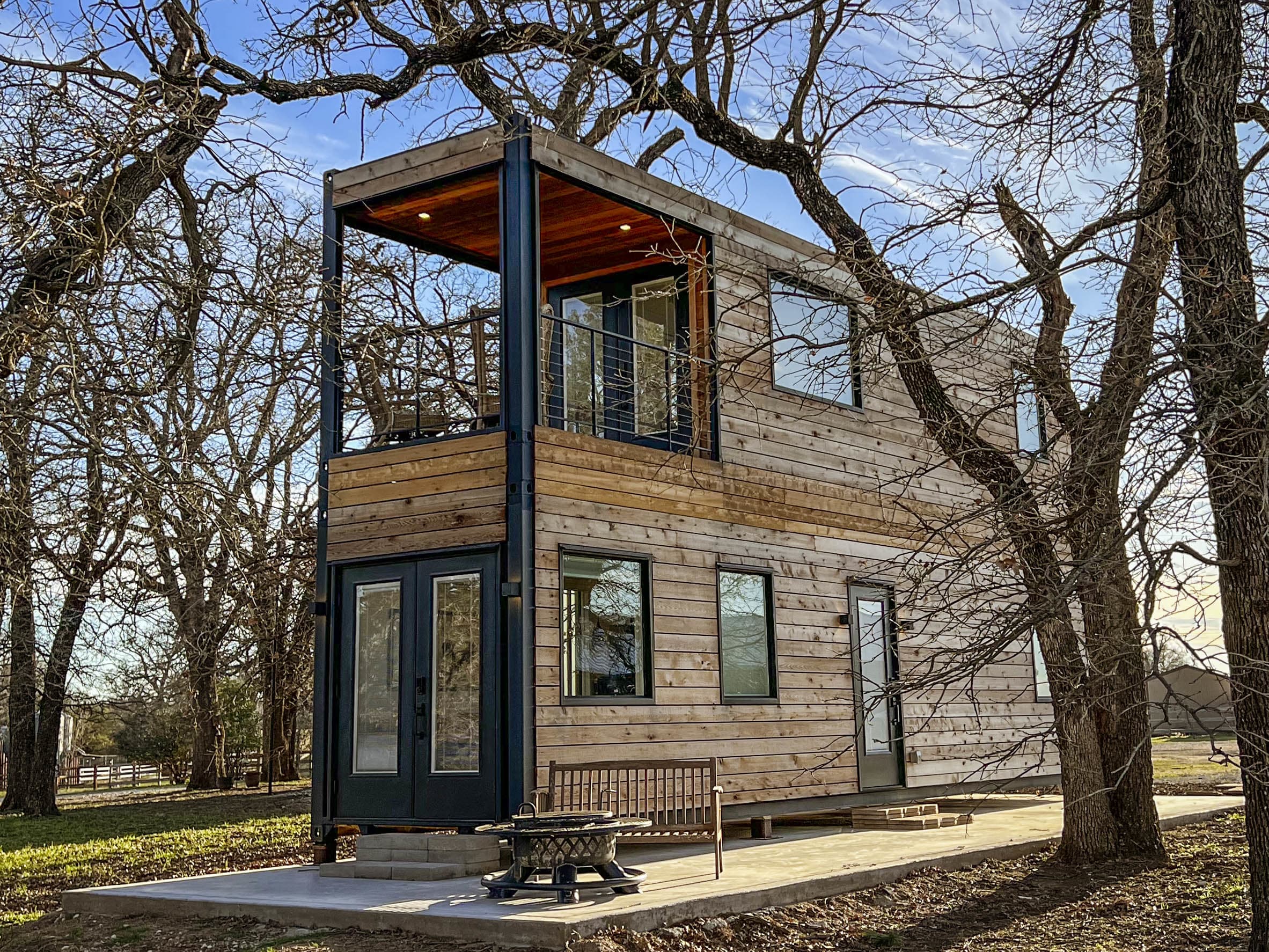Industrial architecture turned intimate retreat at a boldly designed container home in Waco, TX