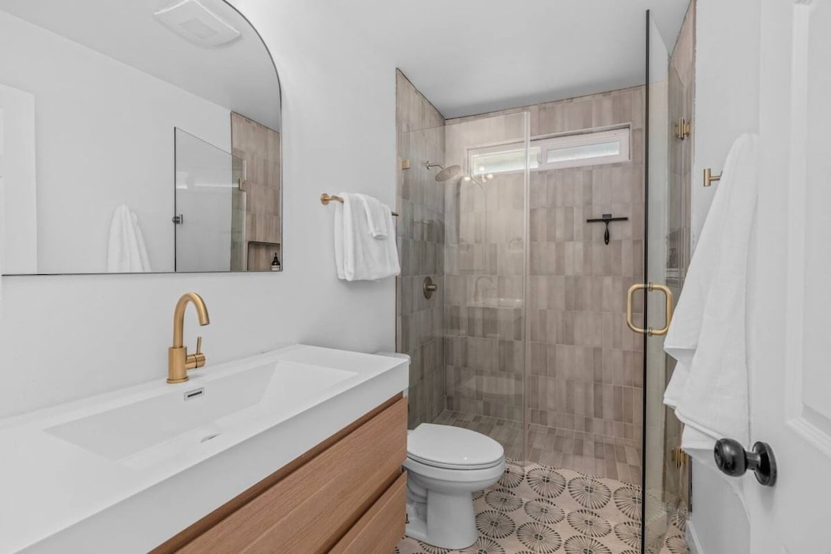 The bathroom is stocked with shampoo, conditioner, bodywash, as well as a hair dryer and plenty of 100% cotton towels for each guest.