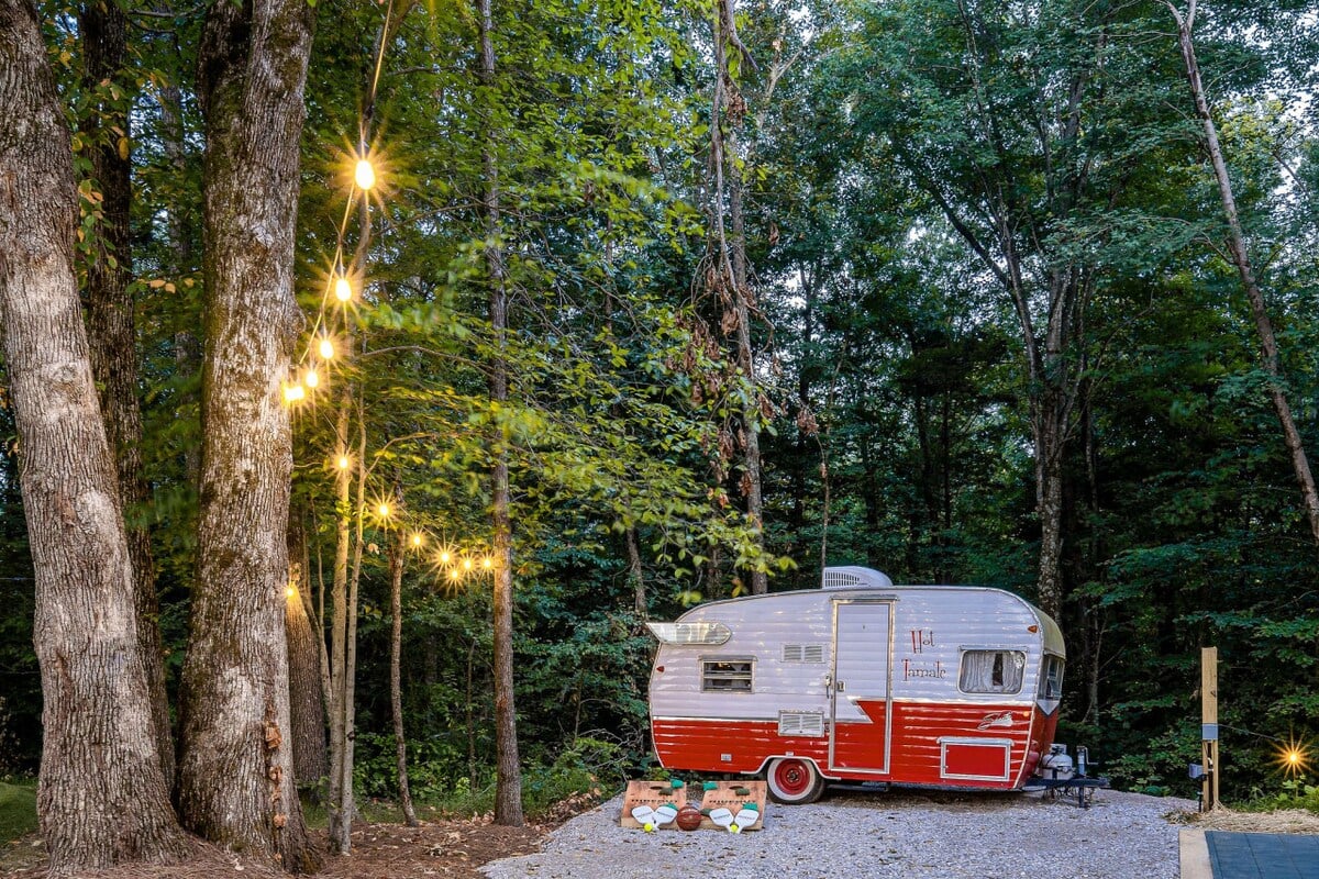 Discover our unique collection of books, magazines, and games tucked away in our charming red Shasta camper.