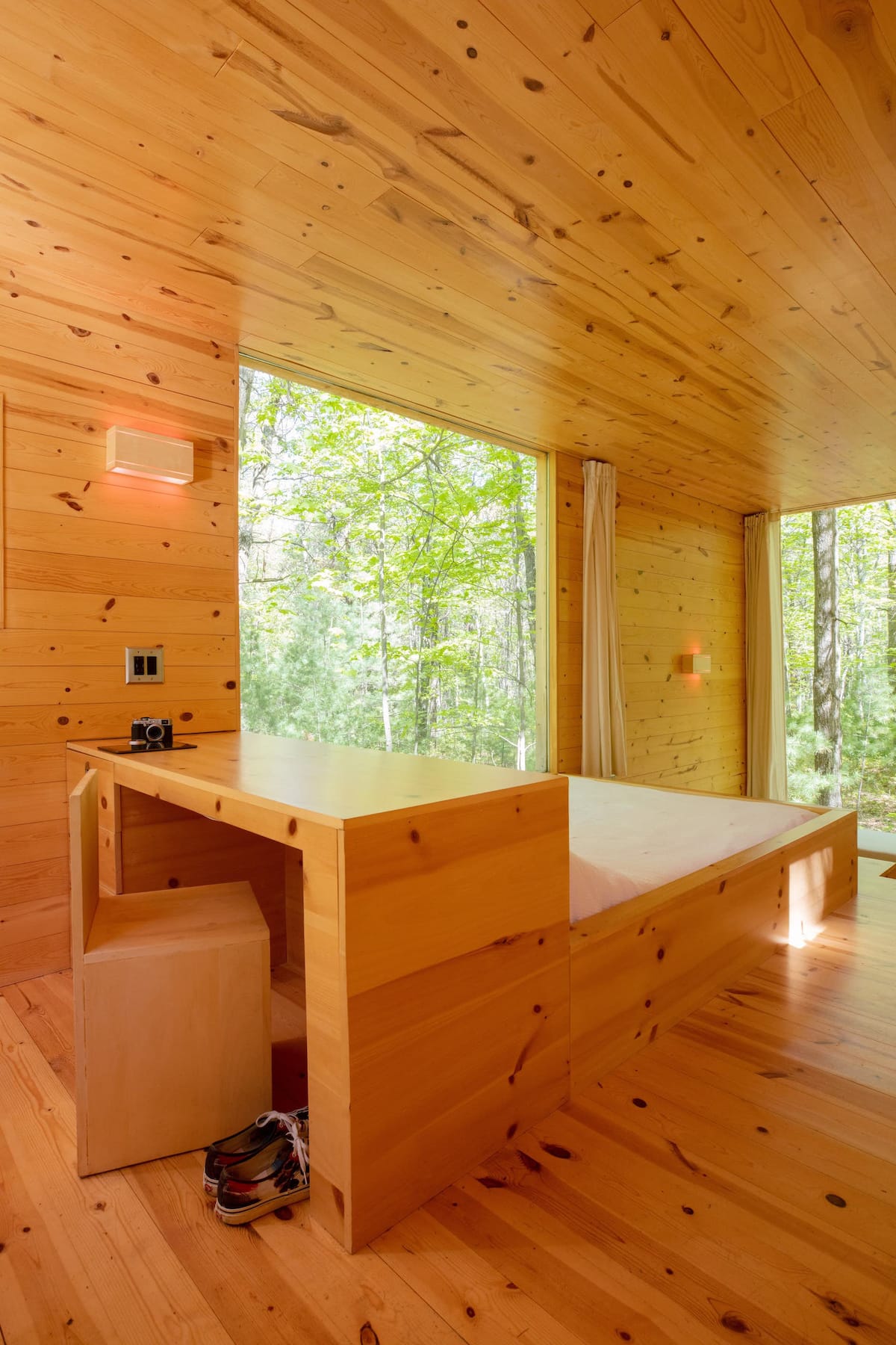 The view of the desk and queen bed as you walk in the house
