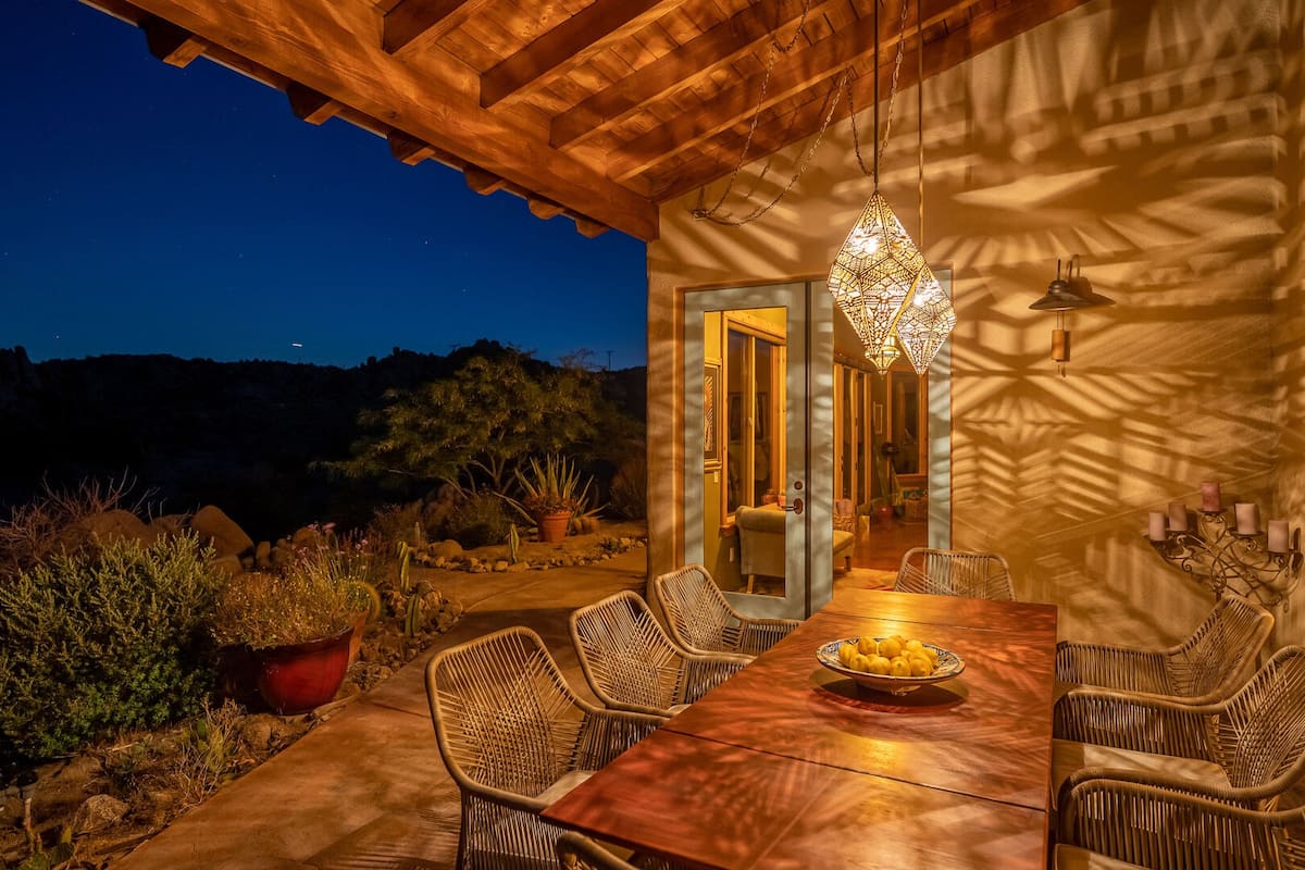 Dining al fresco under the moonlight and Moroccan lanterns.