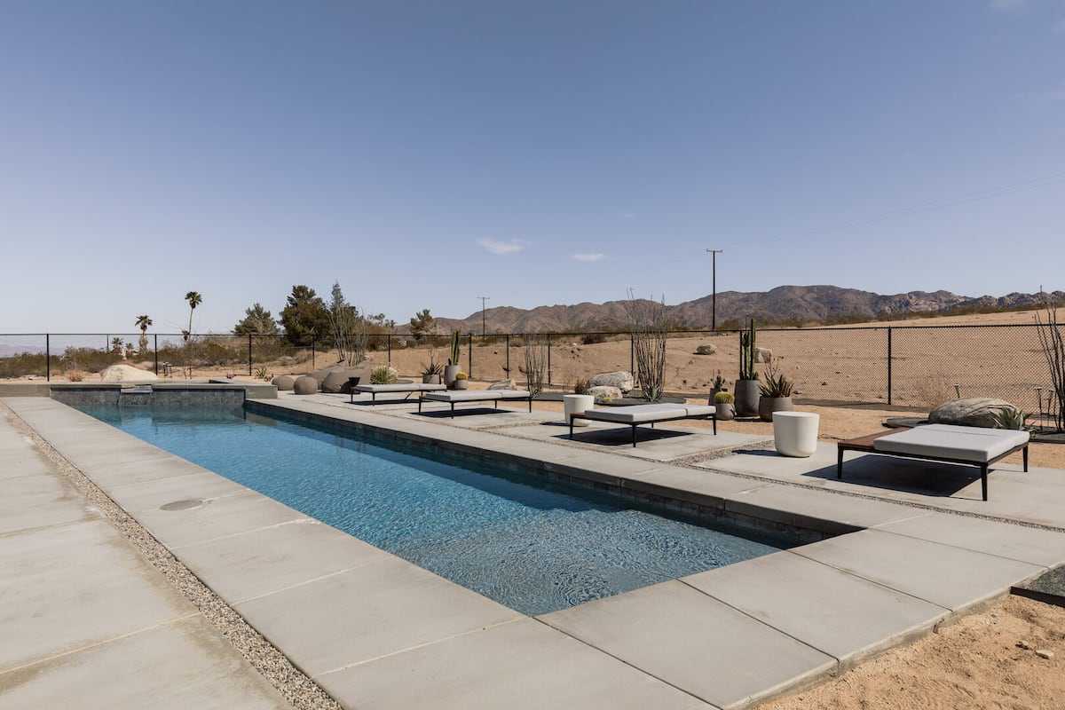 Private pool (pool heating available with fee) & hot tub, with ample lounging, seating, dining, and fire pit