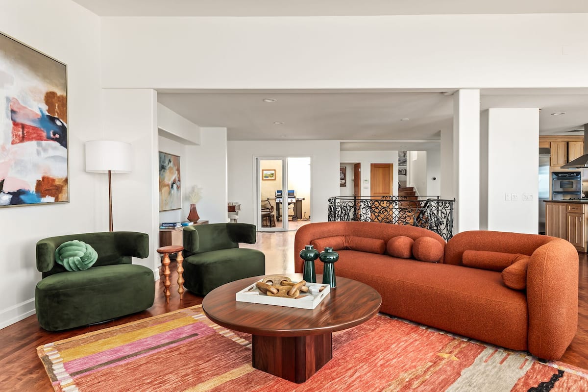 Bright and spacious living room with ocean views, flat screen TV and fireplace