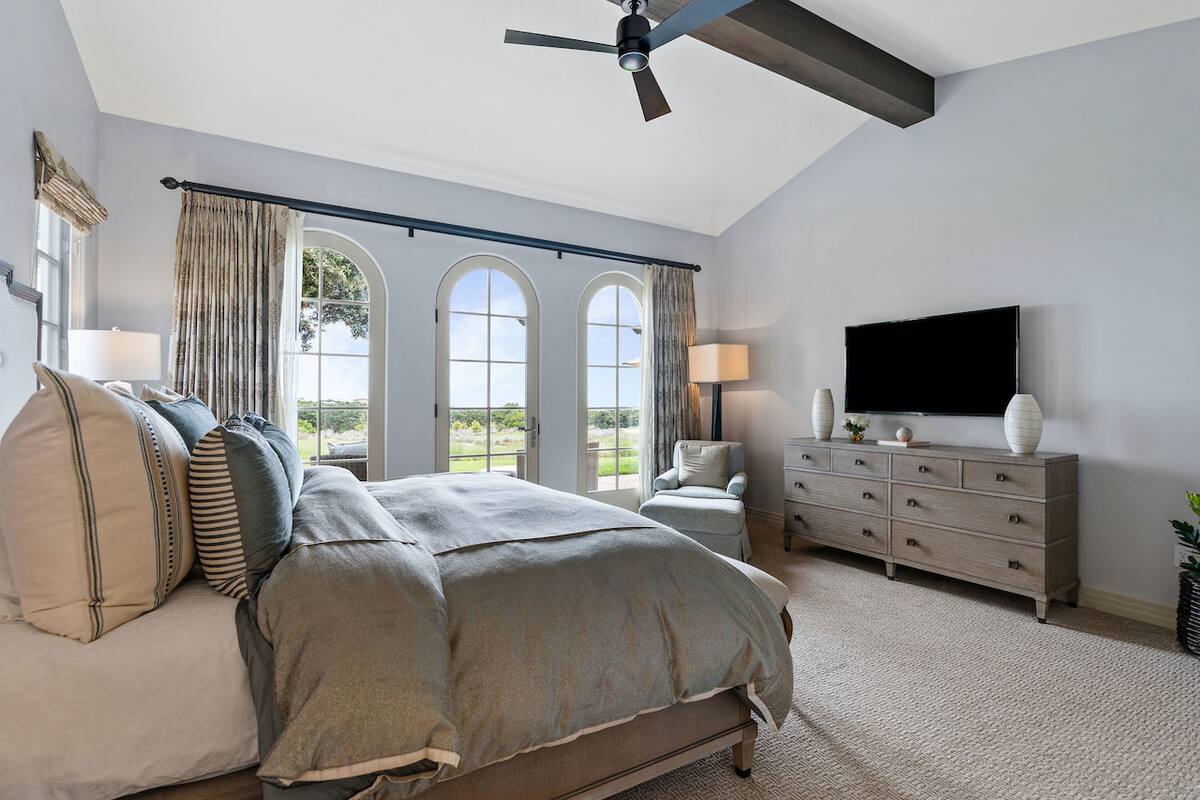 Primary bedroom features a television