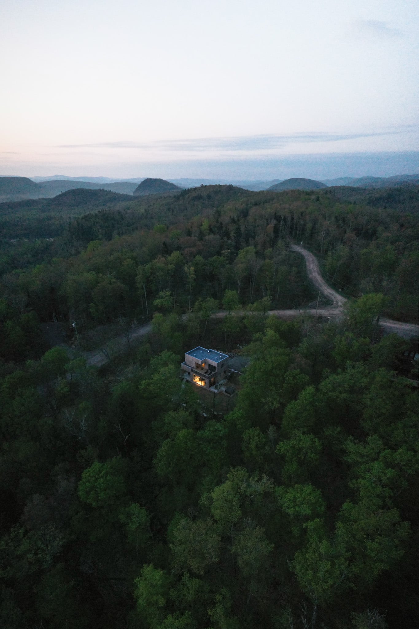 A modernist cabin carved into the forests of Mont-Tremblant in La Conception, Quebec