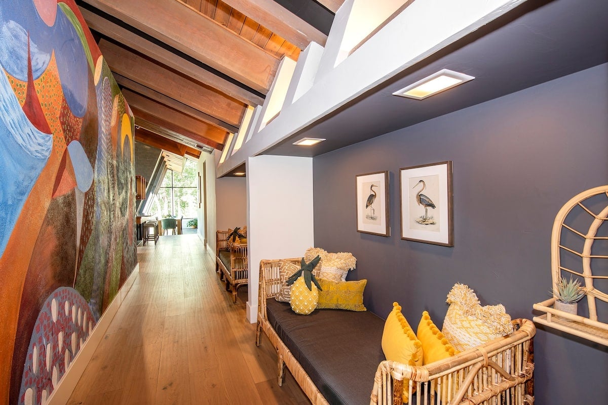 This is looking from the foyer down the main hallway and into the living area.  There are two daybeds that make a great place to sit and enjoy this unique mural or you can convert the day beds into twin-sized beds for sleeping.