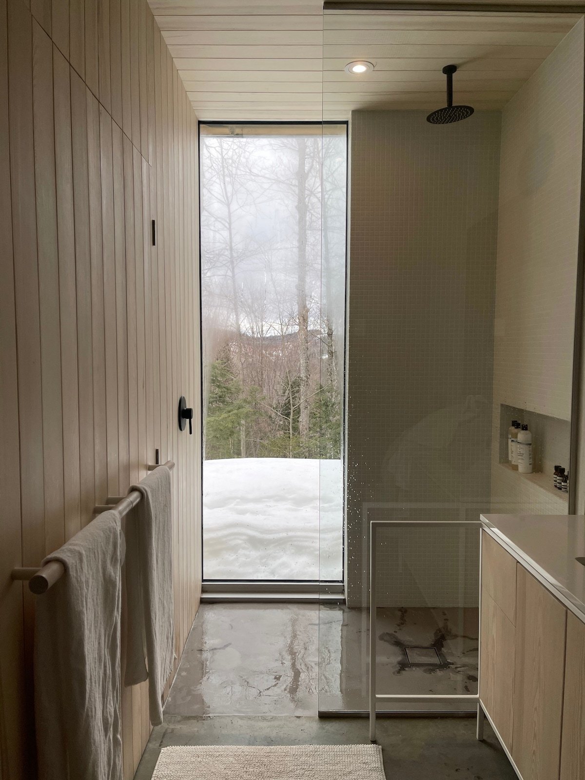 a walk-in rainfall shower blurs the lines between inside and out.