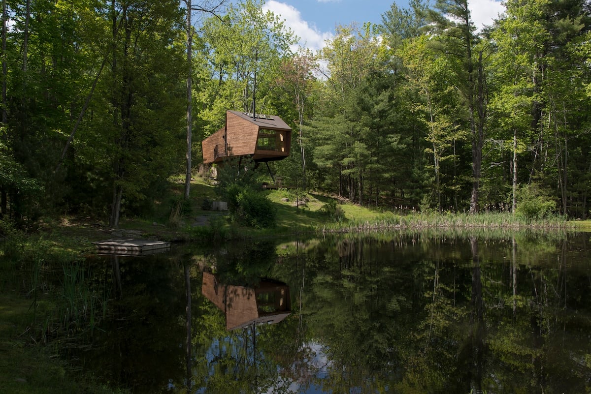 The Treehouse overlooks a natural, swimmable pond