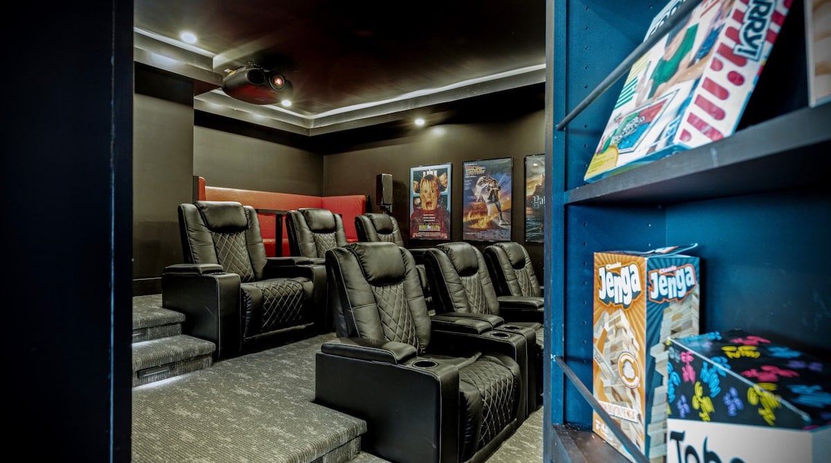 Push the bookcase to reveal the hidden movie theater