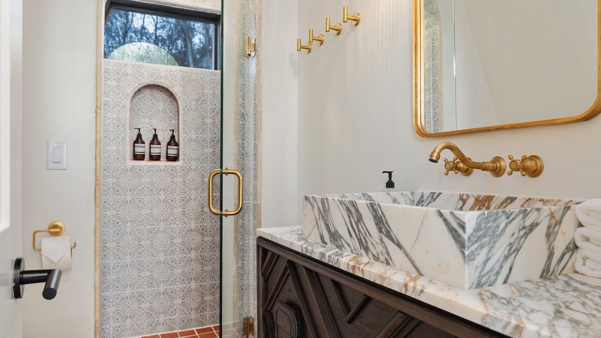 The last door in the corridor features the stunning Moroccan inspired bathroom with a custom marble vanity