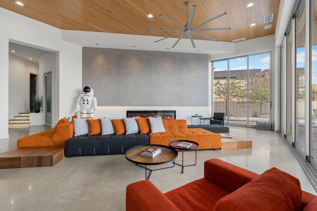 Spacious living area with floor to ceiling glass wall