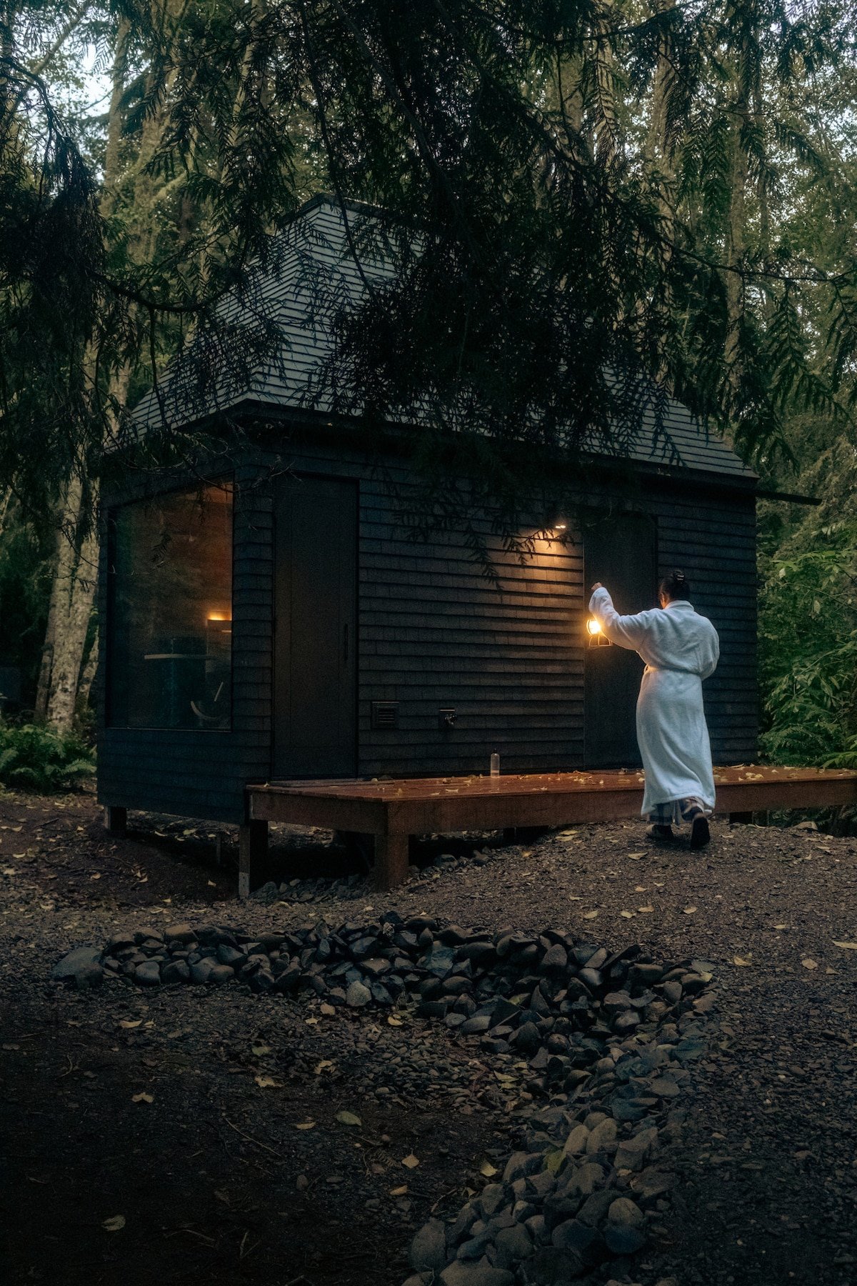 Lantern in hand, sauna in sight. Because nothing says “evening plans” like a private steam under the trees.