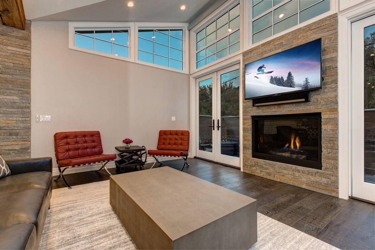 Living Area with Gas Fireplace, Open Floor Plan, Deck Access | Abode at First Chair
