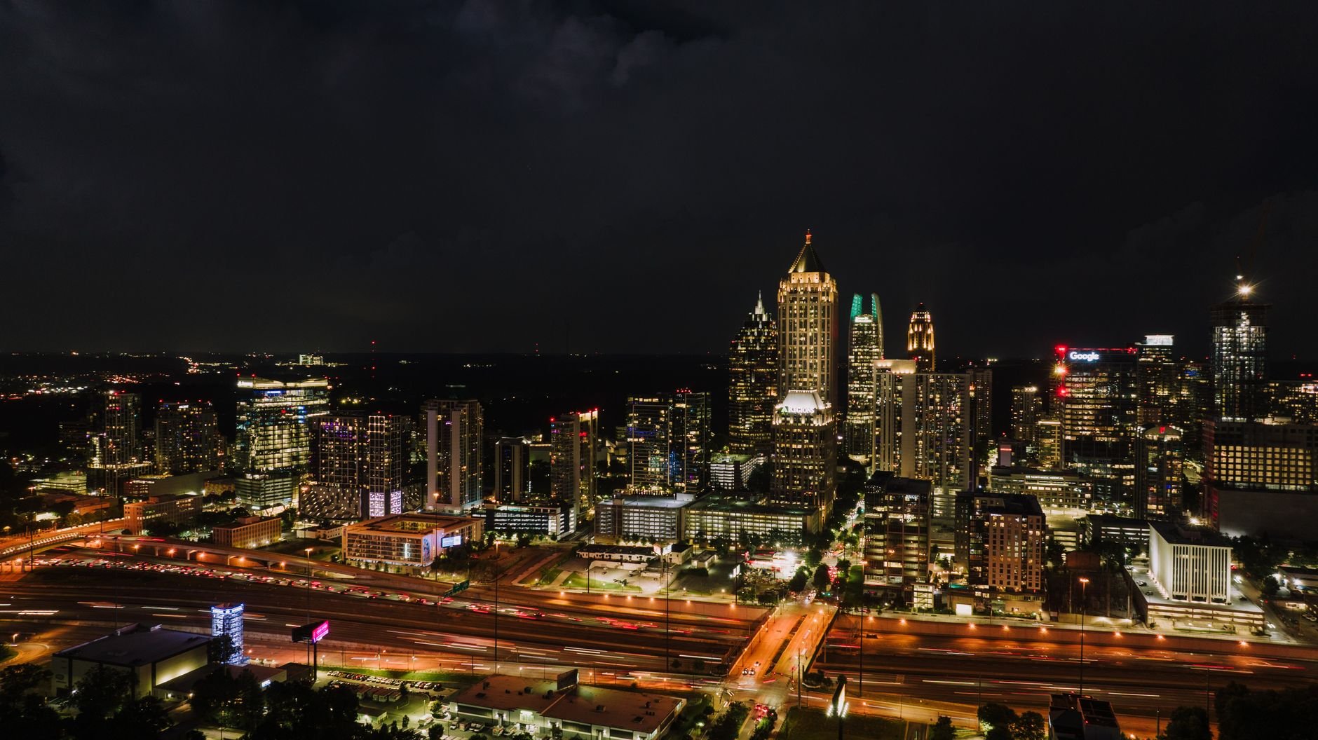 Discover the vibrant Atlanta skyline at night, showcasing the city's illuminated skyscrapers and bustling streets.