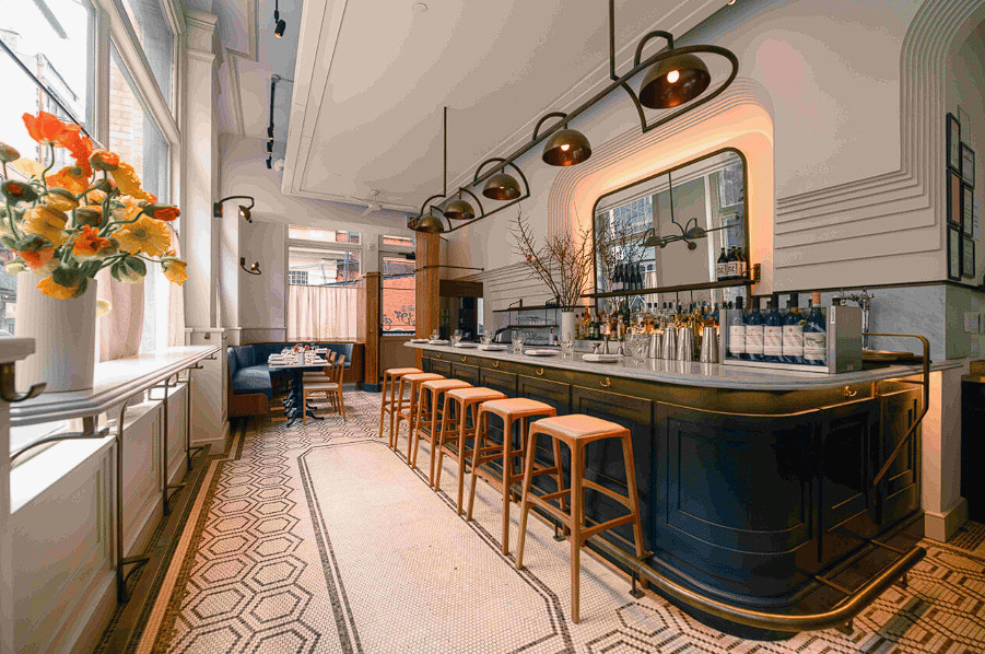 Modern bistro interior with geometric pendant lights and warm ambiance